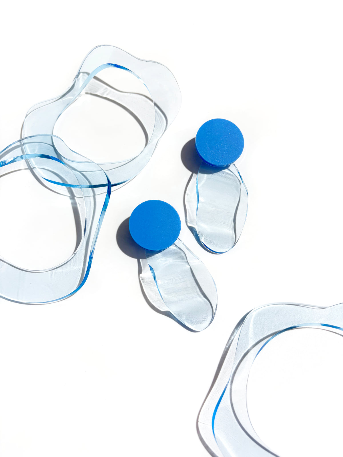 IN Waves Mismatched Studs | Transparent Blue